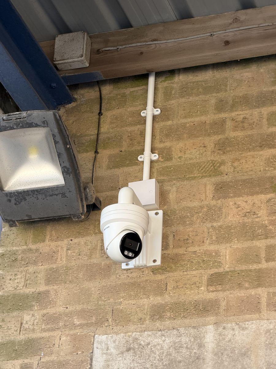 A CCTV camera install with a completely unnecessary junction box above it